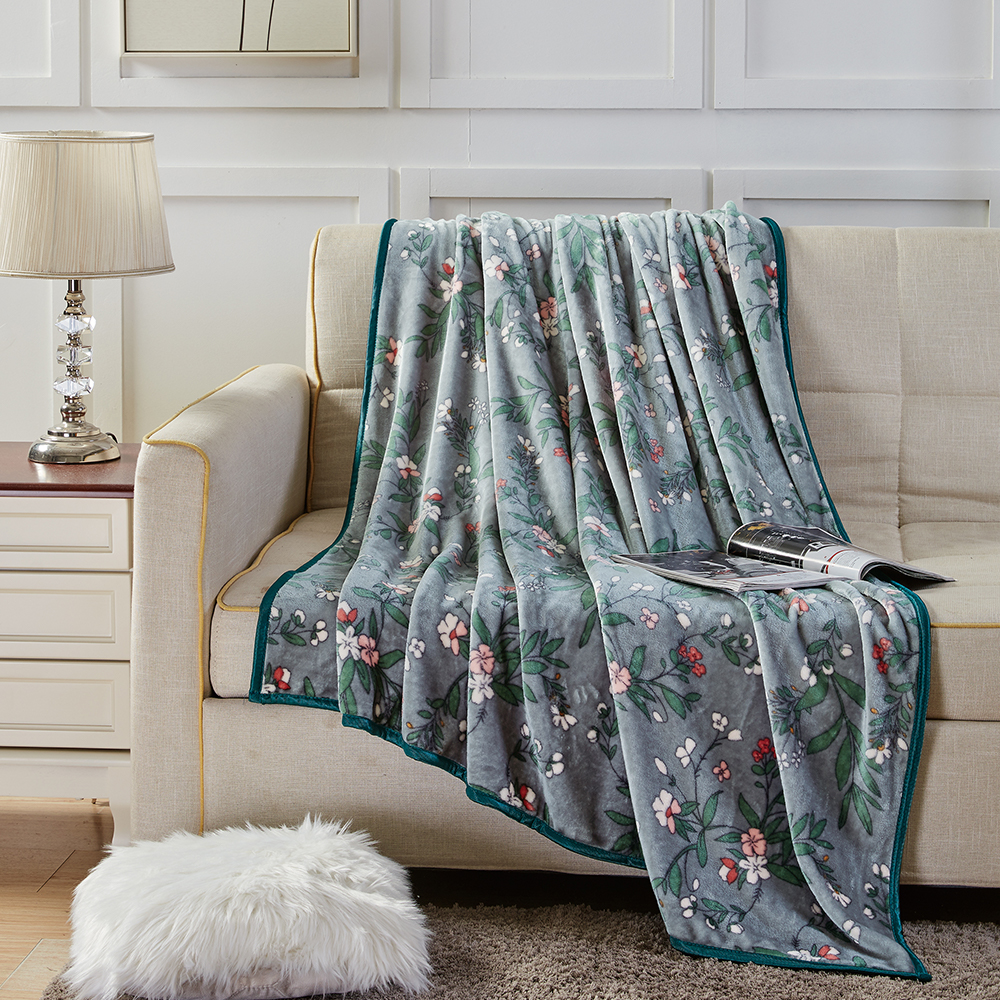 Couverture en flanelle à imprimé floral et feuilles
